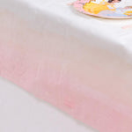 A pink pastel-coloured table cover with a stylish gradient effect