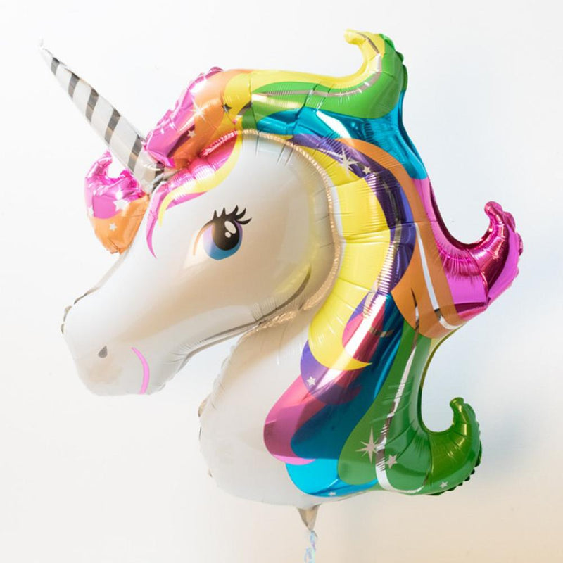 A Unicorn-shaped party balloon with a shiny rainbow foil mane