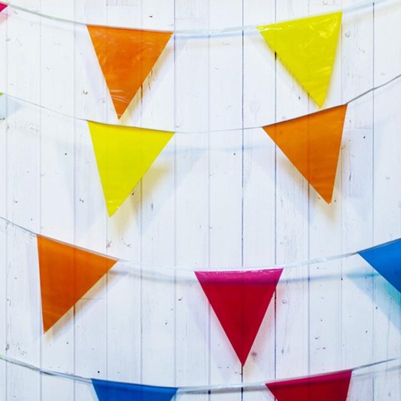 A multicoloured flag bunting with colourful pennants
