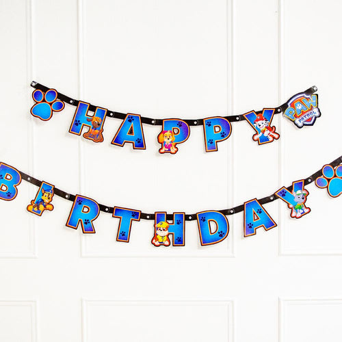 A Happy Birthday party banner featuring all the characters from the Paw Patrol TV show