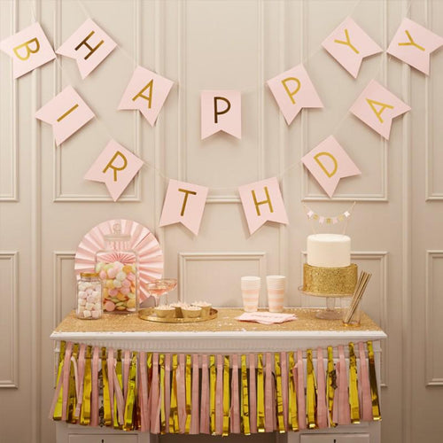 A pink "Happy Birthday" party bunting with flag pennants