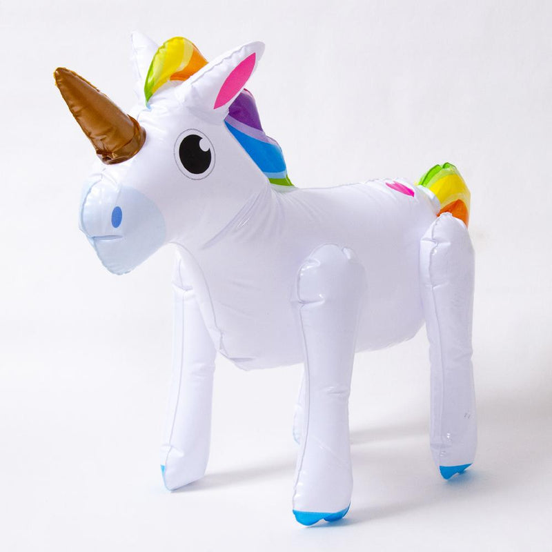 An inflatable party unicorn with gold horn and rainbow-coloured mane