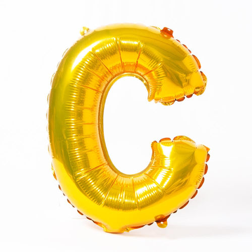 A shiny metallic gold letter "C" balloon