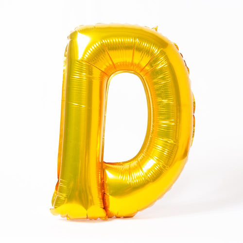 A shiny metallic gold letter "D" balloon