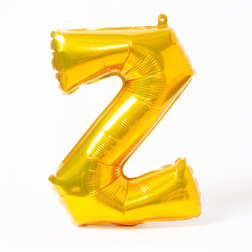 A shiny metallic gold letter "Z" balloon