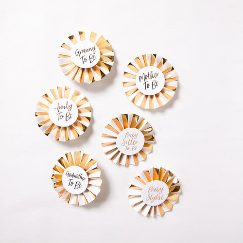 6 gold and white baby shower roundels with cursive text phrases