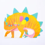 A biodegradeable dinosaur party napkin featuring a Stegosaurus holding party balloons