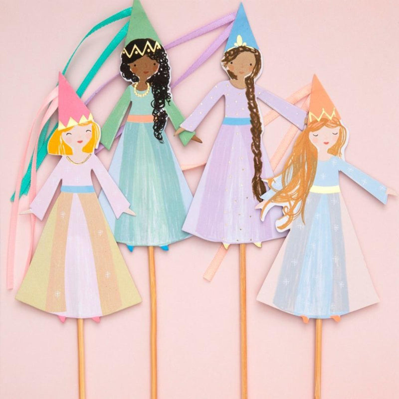 A set of 4 princess-shaped cake toppers