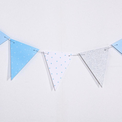 A 1st birthday party bunting with blue and white flag pennants
