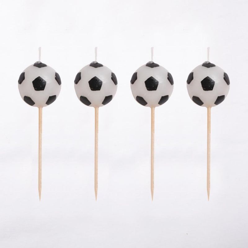 4 football-shaped party cake candles with wooden picks