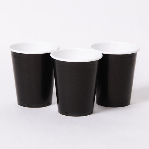3 black paper party cups with white rims