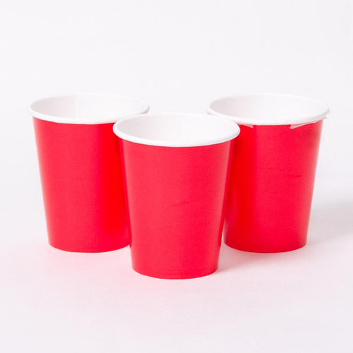 3 bright red party cups with white rims
