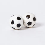 A pair of bouncy balls in the shape and stlye of the classic black and white football